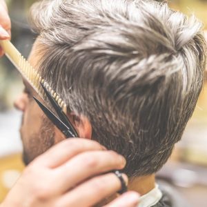 Image of man getting a haircut at a barber shop